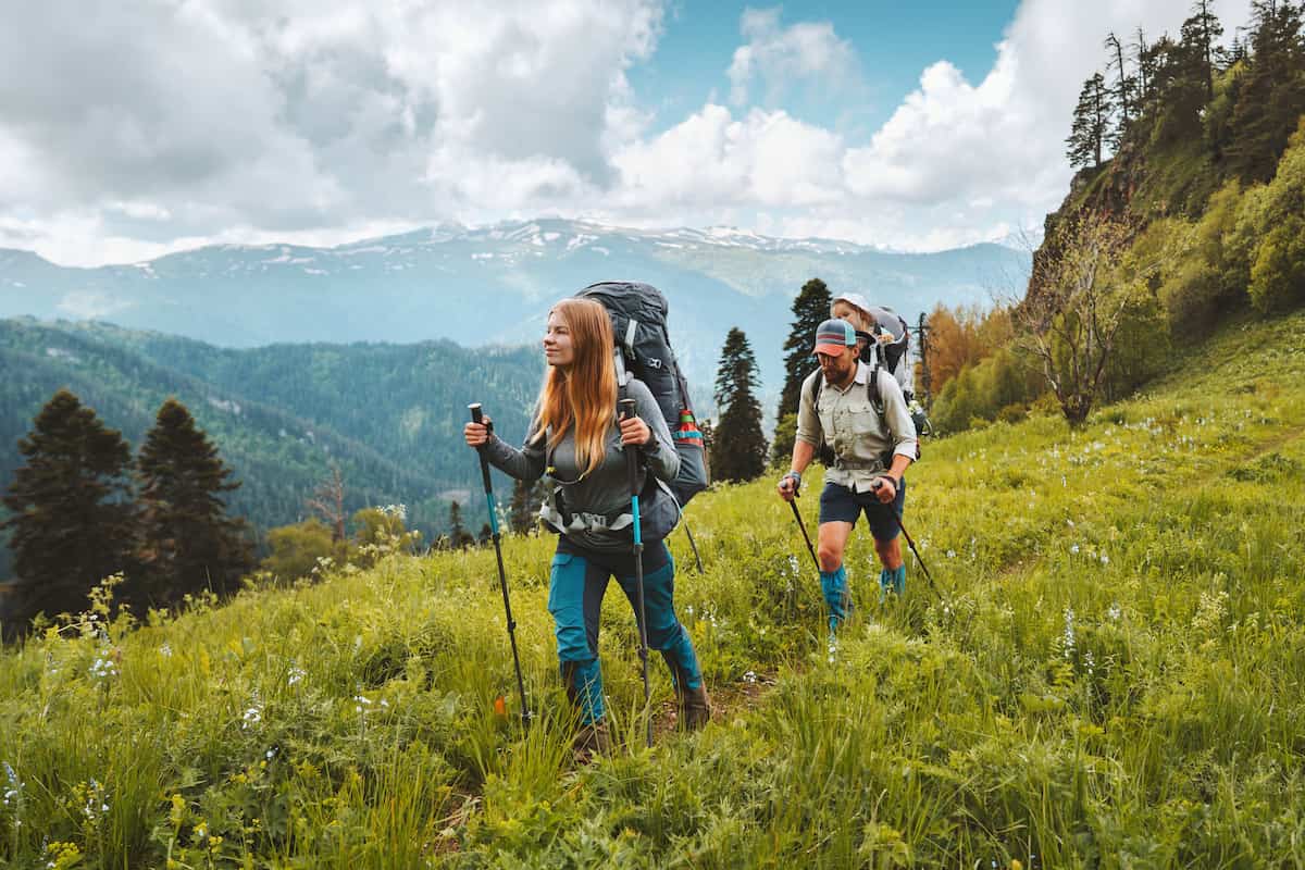 a young family hiking on a mountain
