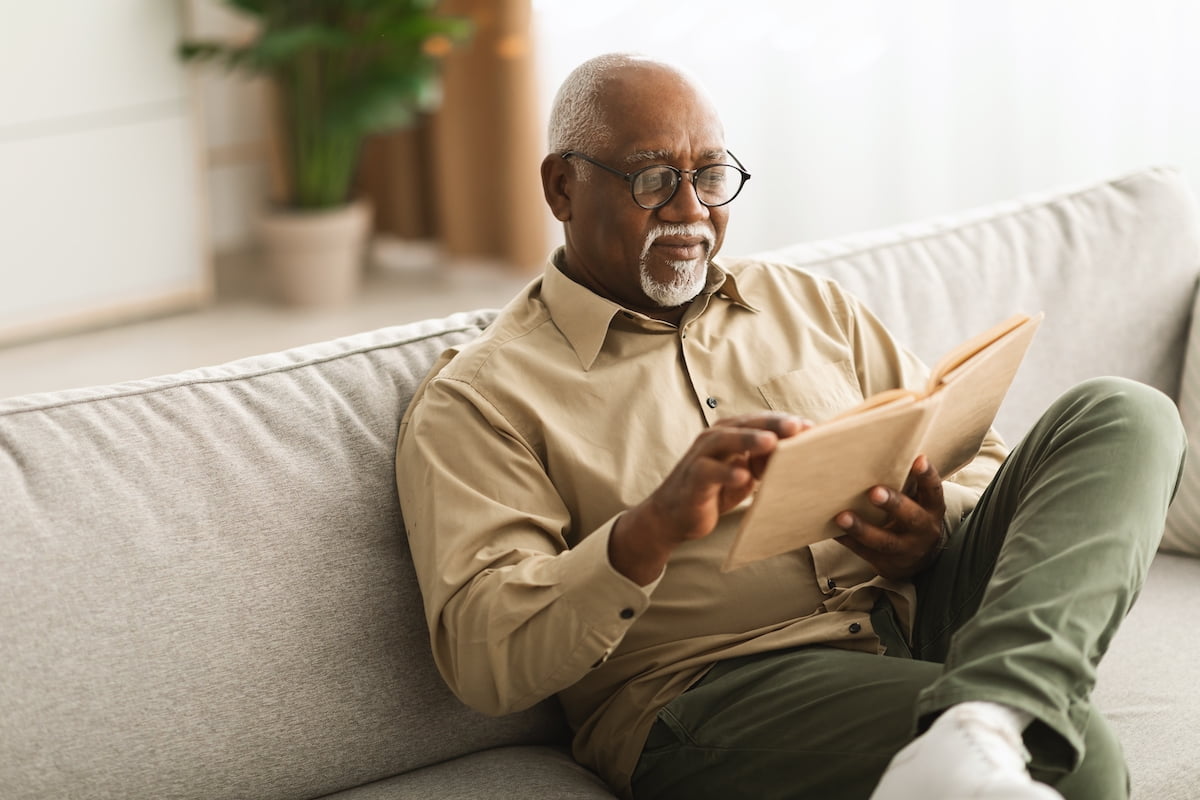 senior man reading with glasses