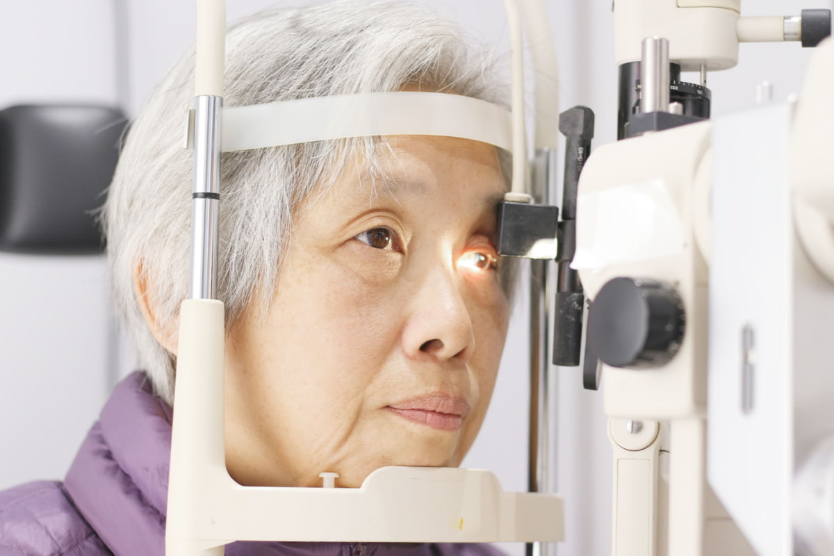 senior woman having her eyes examined