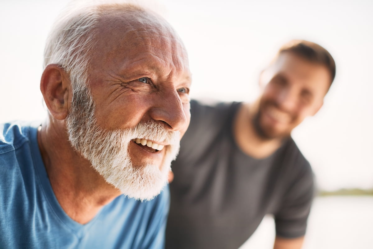 senior man exercising and smiling