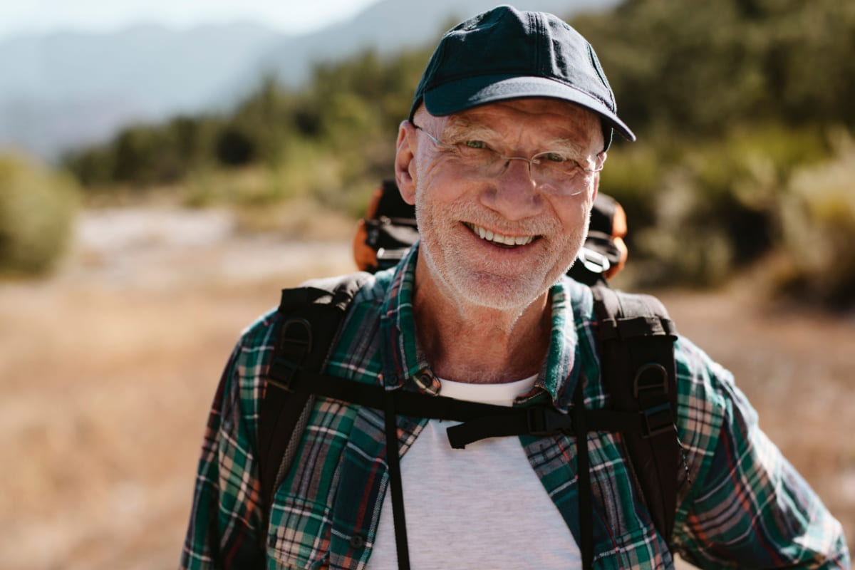 mature man hiking a mountain